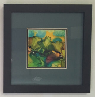 Abstract art painting of green like flowers framed