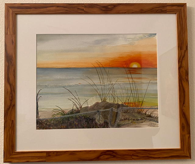 Art painting of a sunset in the ocean framed